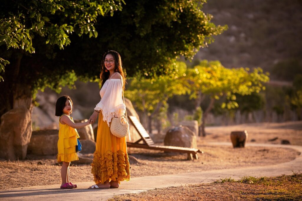 A mother and daughter blend cultures by cooking a traditional Sri Lankan meal in a modern kitchen.